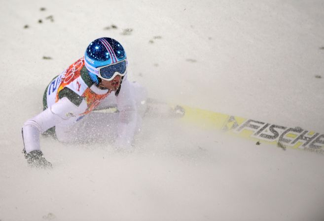 Slovenia's Robert Kranjec lies in the snow after falling in the men's normal hill ski jumping event Saturday, February 8.