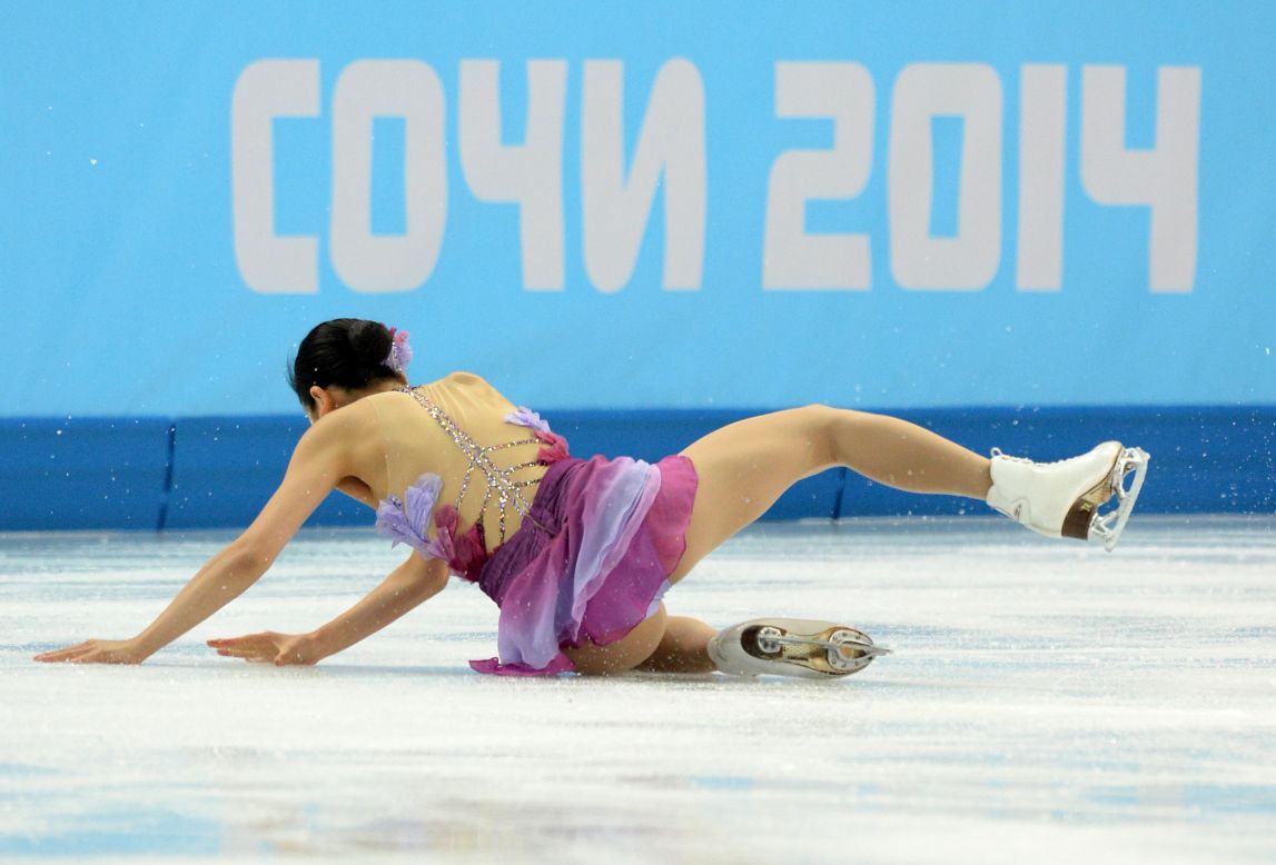 Japan's Mao Asada falls as she performs in the team figure skating event on February 8.