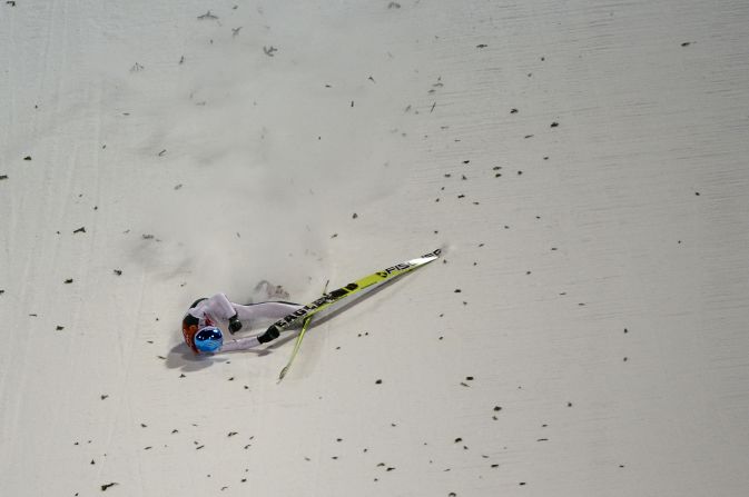 Slovenia's Robert Kranjec falls while competing in the men's normal hill ski jumping event.