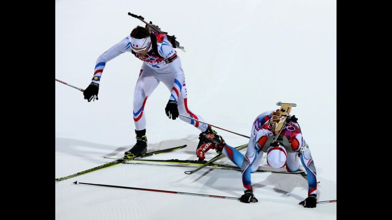 Biathletes Simon Desthieux of France and Ondrej Moravec of the Czech Republic get their skis tangled during the 10-kilometer sprint February 8.