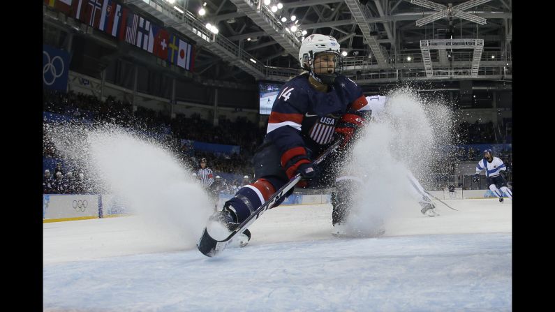 Brianna Decker of the United States fights for the puck during a Group A match between the U.S. and Finland on February 8.