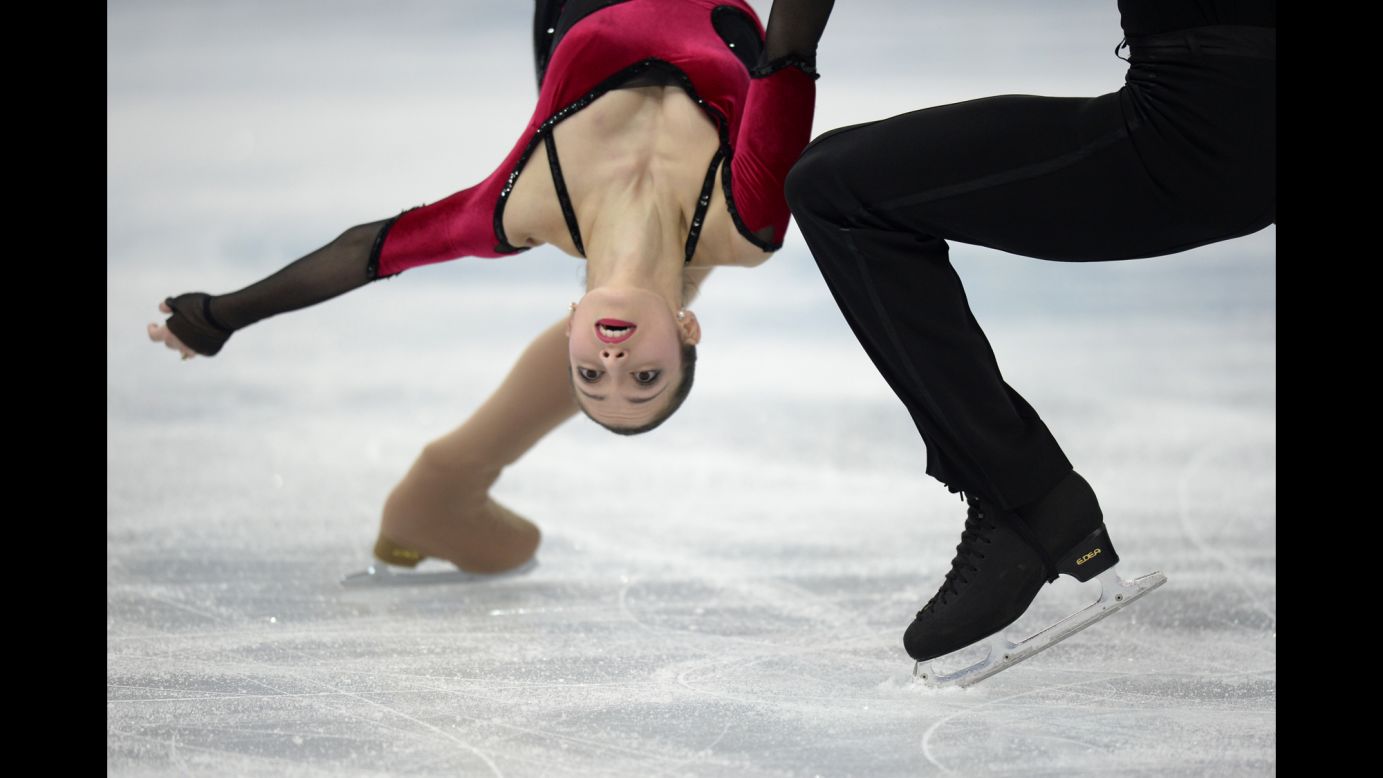 Italy's Stefania Berton and Ondrej Hotarek perform during the pairs portion of the team figure skating event.