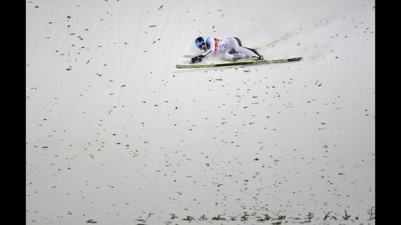 Slovenia's Robert Kranjec falls while competing in the men's normal hill ski jumping event on February 8.