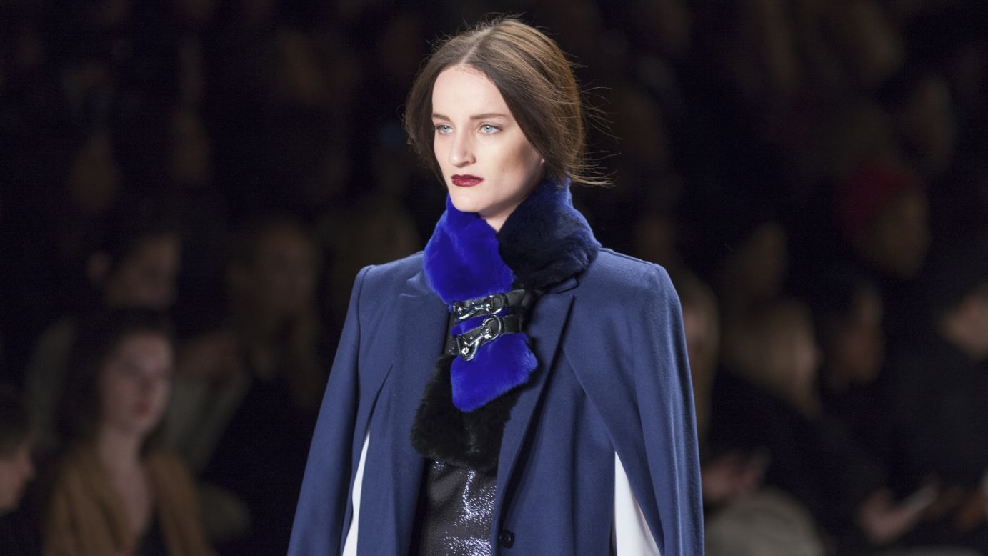 Rebecca Minkoff sends a model down the runway in a slew of navy tones and a belted fur stole.