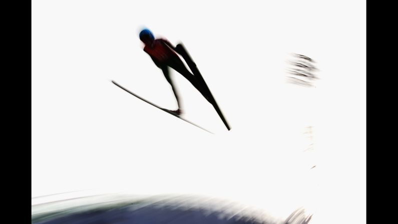 Helena Olsson Smeby of Norway jumps February 9 during training for the women's normal hill ski jumping event.