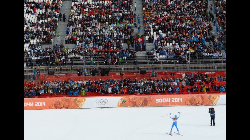 A picture taken with a robotic camera shows Italian skier Christof Innerhofer reacting in the finish area after his run in the downhill.