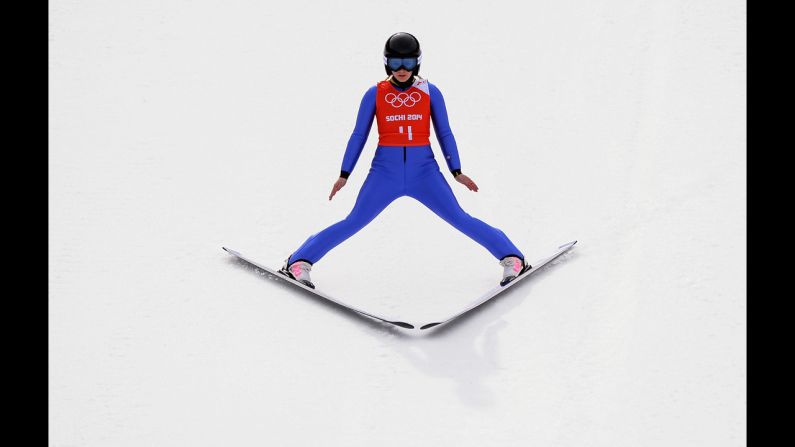 Chiara Hoelzl of Austria lands her jump during training for the normal hill ski jumping event.