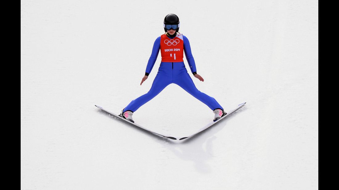 Chiara Hoelzl of Austria lands her jump during training for the normal hill ski jumping event.