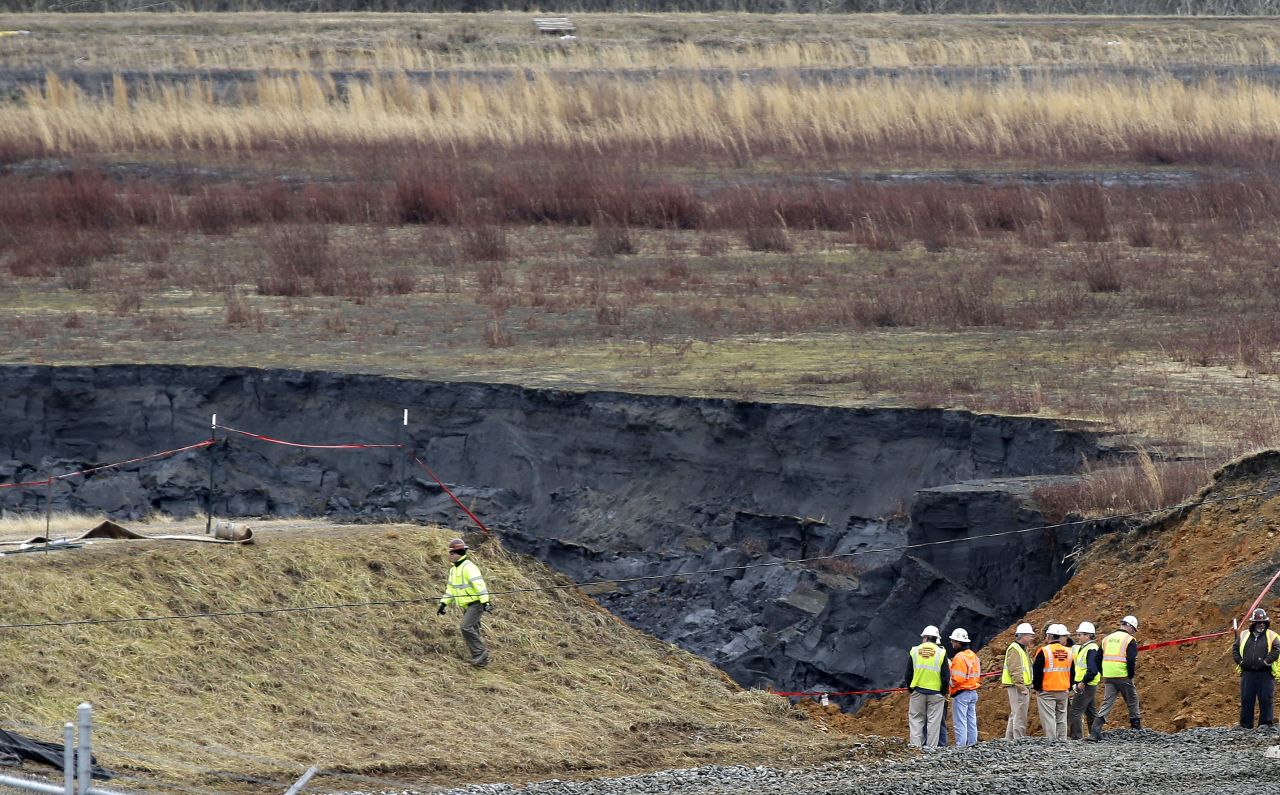 Duke Energy engineers and contractors survey the site of a coal ash spill at the Dan River power plant in Eden, North Carolina, on February 5. 