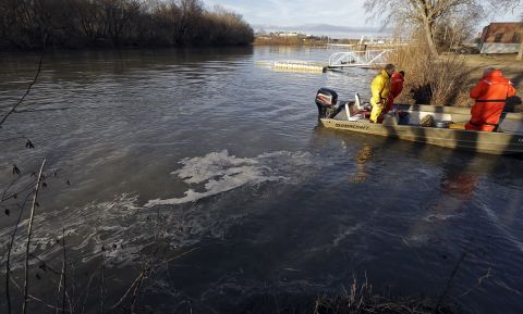 State and federal officials dock after collecting sediment samples as coal ash floats on the water of the Dan River on February 5. 