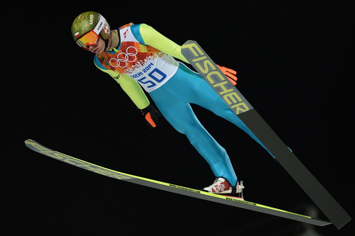 Kamil Stoch of Poland soars to victory in the ski-jumping normal hill competition one of eight golds claimed on the second day of finals in Sochi.