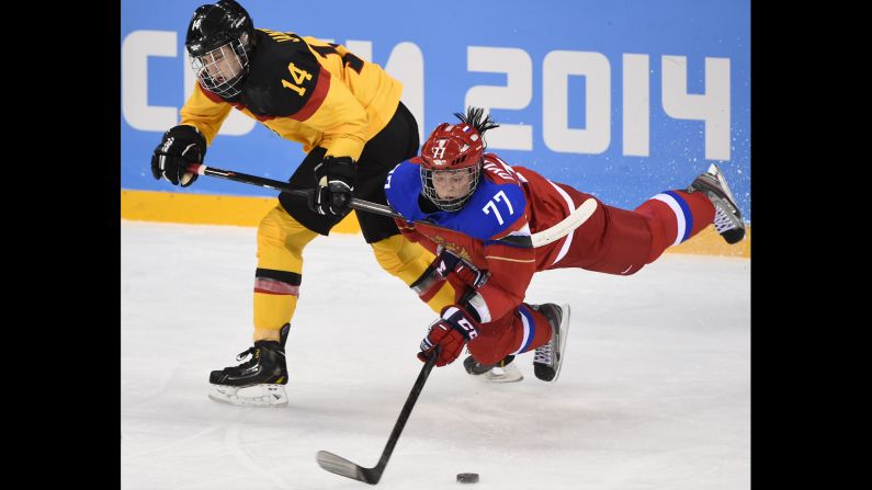 Germany's Jacqueline Janzen, left, vies with Russia's Inna Dyubanok during a women's ice hockey match on February 9. 