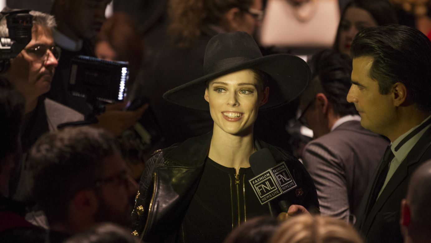 Model Coco Rocha is interviewed on the runway prior to Herve Leger show.