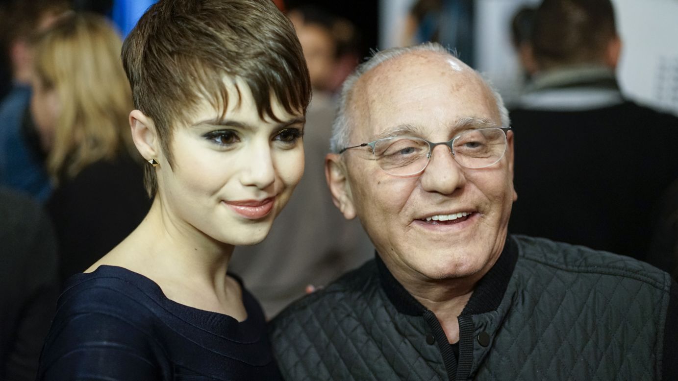 Max Azria, who designs the Herve Leger collections, poses with actress Sami Gayle backstage before his show.