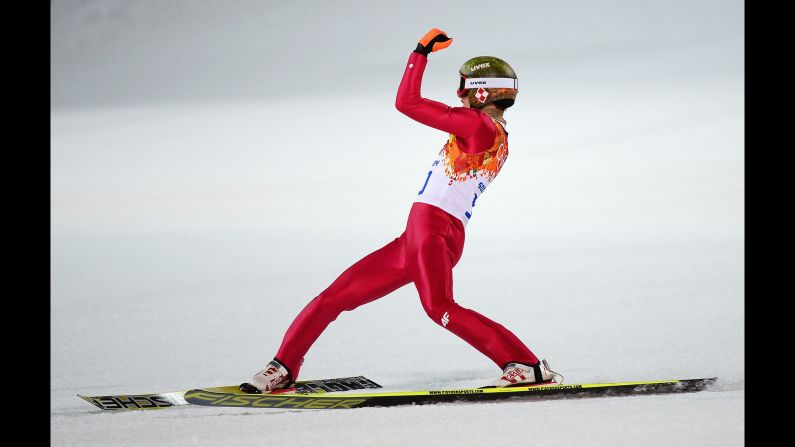 Kamil Stoch of Poland celebrates his gold-medal performance in the normal hill ski jumping event February 9.