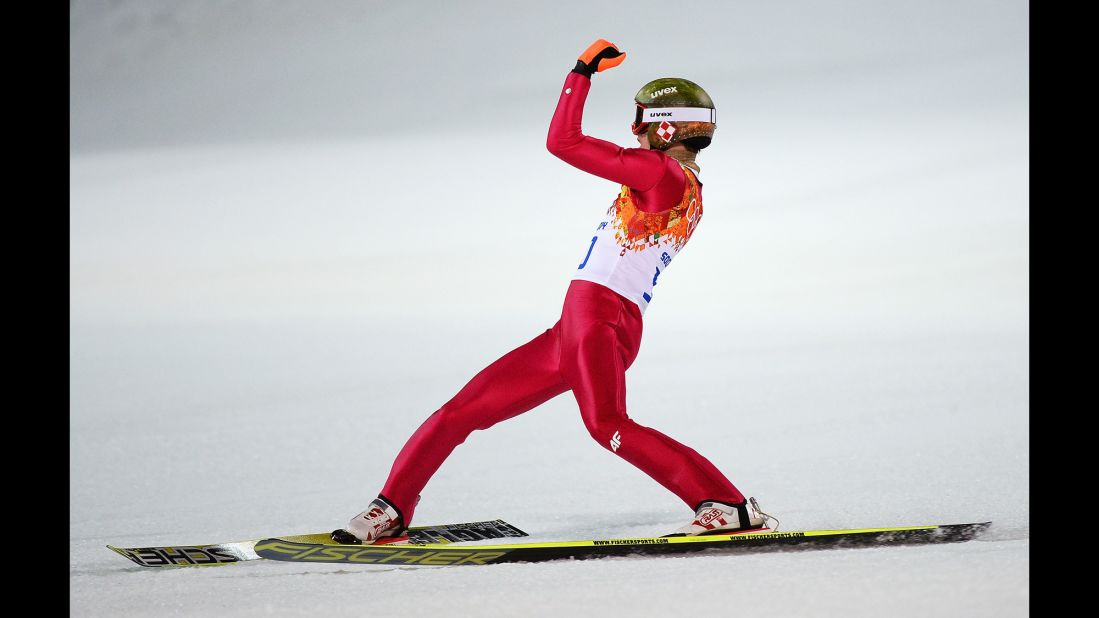 Kamil Stoch of Poland celebrates his gold-medal performance in the normal hill ski jumping event February 9. 