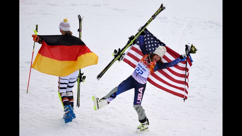 Germany's Maria Hoefl-Riesch, left and U.S. skier Julia Mancuso pose by the podium after the super-combined event on February 10. Hoefl-Riesch won gold and Mancuso won bronze.