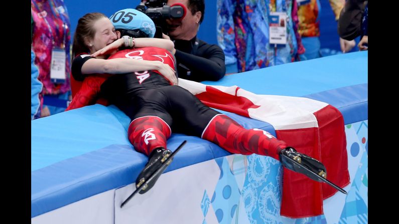 Charles Hamelin of Canada celebrates with his girlfriend, Marianne St-Gelais, after winning the 1,500-meter race in short track speedskating February 10.
