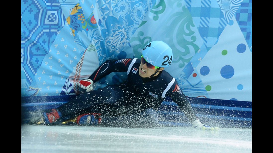 South Korea's Sin Da-Woon falls as he competes in the 1,500-meter short track semifinals on February 10.