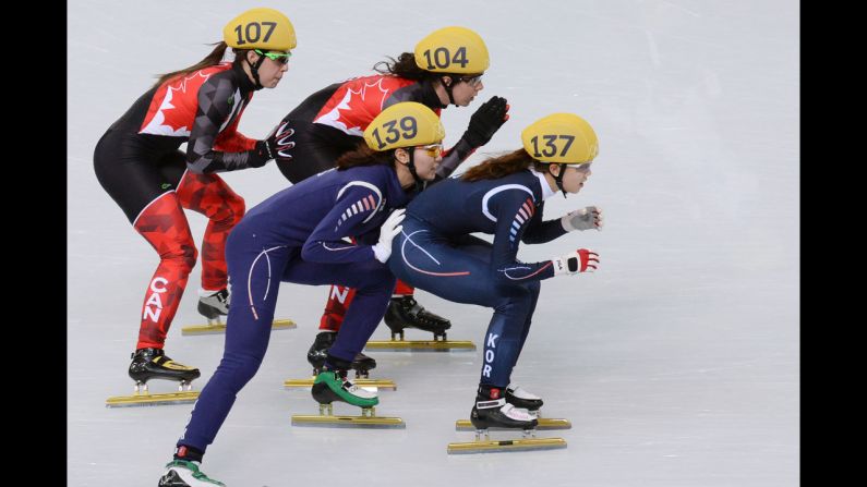 South Korea's Shim Suk-Hee, front left, South Korea's Kong Sangjeong, front right, Canada's Valerie Maltais, back left, and Canada's Marie-Eve Drolet compete in the 3,000-meter short track relay February 10.
