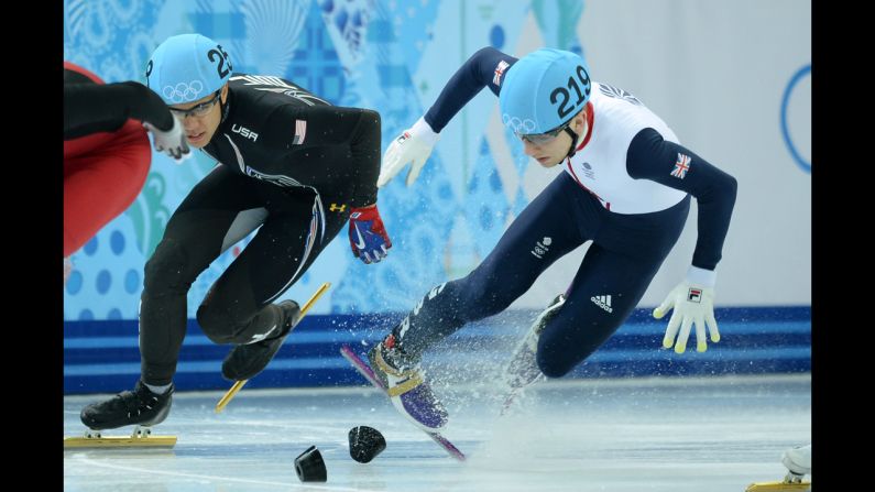 Great Britain's Jack Whelbourne, right, falls as he competes in the 1,500-meter short track final on February 10.