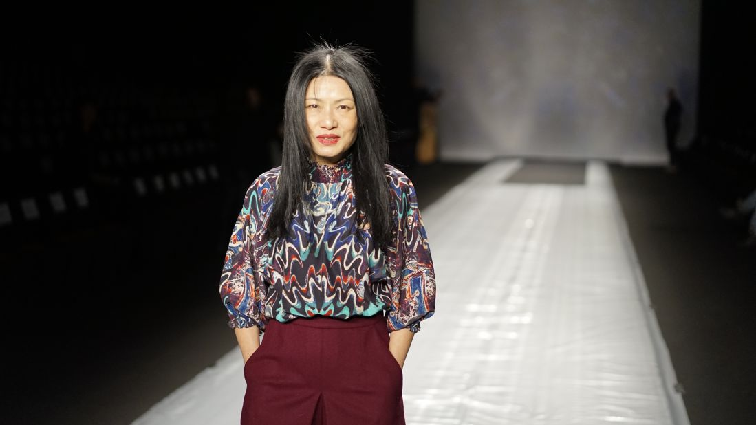 Vivienne Tam showed her collection on February 9. Here, the designer is seen fine-tuning details before her big show.