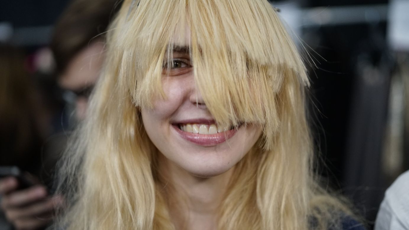 A model gets hair extensions added for the Custo Barcelona show on February 9.