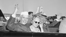 HOLD FOR RELEASE UNTIL 12:01 EDT AM TUESDAY, NOV. 24, 2009 ** FILE - In this Oct. 11, 1949, file photo Prime Minister Jawaharlal Nehru of India, left, Indian Ambassador to the United States and Nehru's sister, Mme. Vijaya Pandit, and President Harry S. Truman, right, wave from an automobile as they leave National Airport in Washington. Nehru arrived from London in the president's personal plane for a good will visit. The State Dinner for Nehru, India's first prime minister, was notable because it wasn't at the White House. The mansion was being repaired and Truman and first lady Bess Truman had decamped to Blair House, the government guest house across the street. (AP Photo/File)