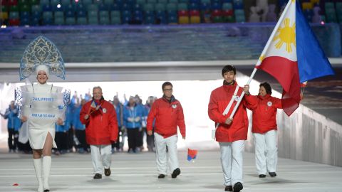 Philippines' flag bearer, Michael Christian Martinez, leads his national delegation during the Opening Ceremony of the 2014 Sochi Winter Olympics.