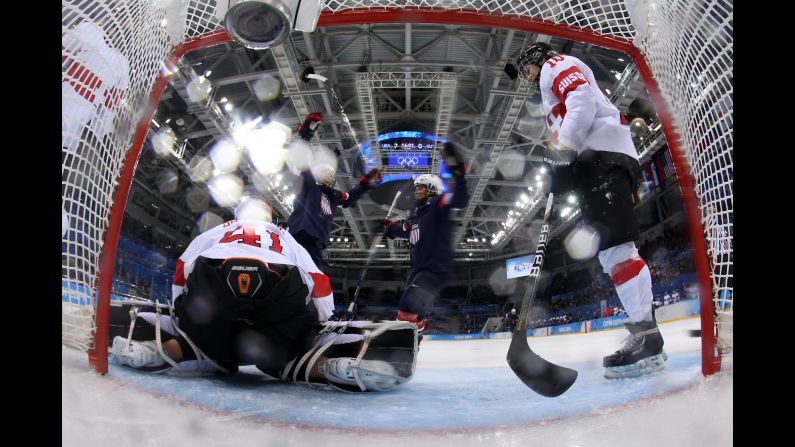 U.S. hockey player Kendall Coyne, second from left, celebrates one of her goals against Switzerland on February 10.