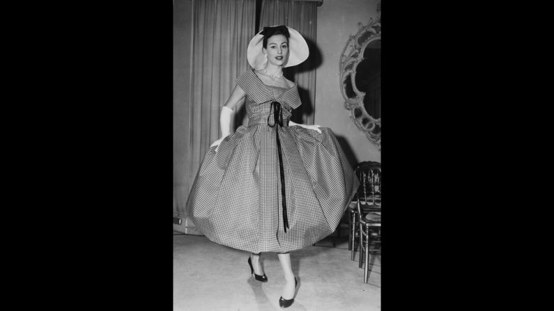 In 1957, Pagan Grigg models a black-and-white window pane-check organza dress from Christian Dior.