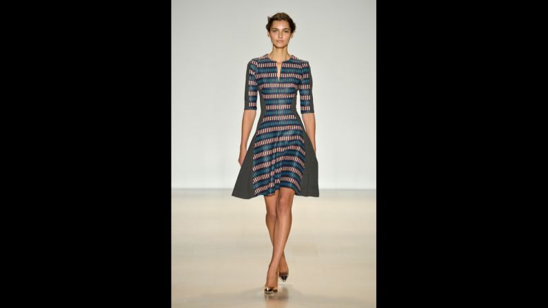 This Lela Rose dress shown during Mercedes-Benz Fashion Week Fall 2014 incorporates polished fabric and a full skirt.