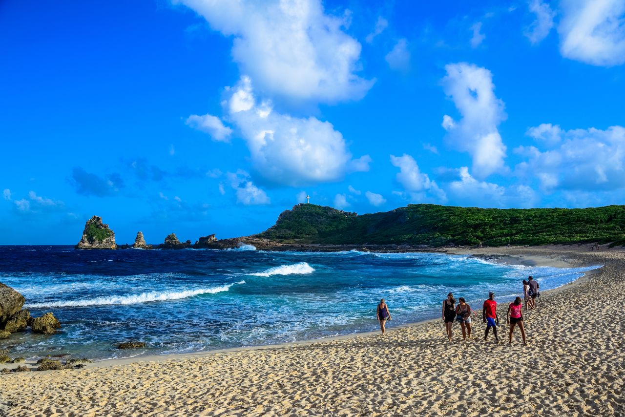With dramatic cliffs surrounding a white sand beach, one of Guadeloupe Islands' most striking landscapes is reminiscent of the Mediterranean. 