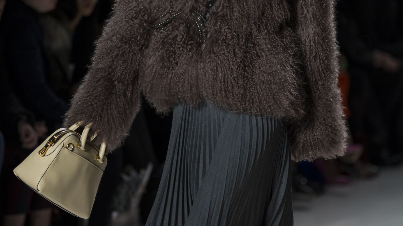 Michelle Smith paired a fur sweater with a flowing, pleated skirt for one of her looks.