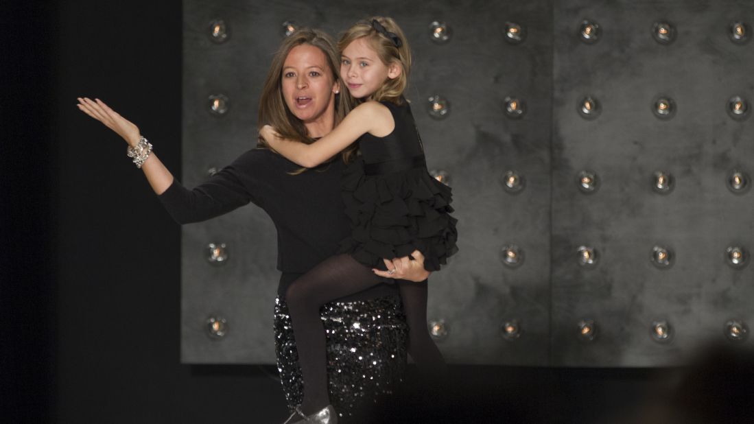 Designer Michelle Smith and her daughter came out to applause at the end of her fashion show on February 10.