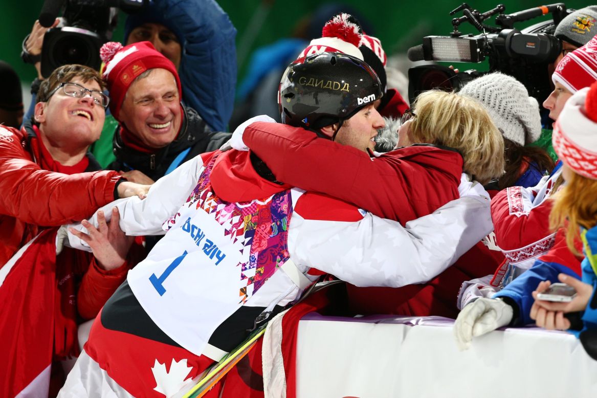 Alex Bilodeau of Canada celebrates with his family after winning the gold medal in the men's moguls on Monday, February 10.