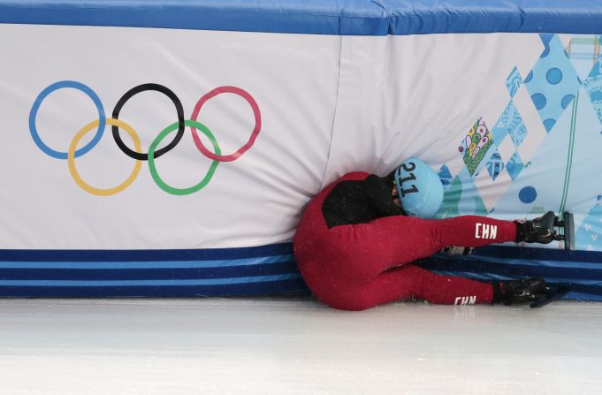 Speedskater Shi Jingnan of China crashes in a men's 1,500-meter short track race on February 10.