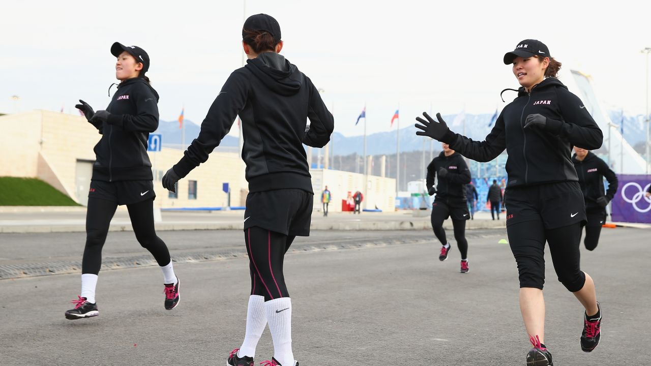 Japan's Women's ice-hockey team warms up -- literally -- in balmy conditions on Day 2 of the Sochi 2014 Winter Olympics.
