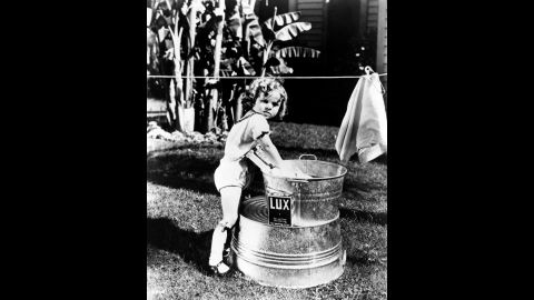 Temple poses for a promotional photograph for one of the "Baby Burlesks" series of short films, circa 1932.