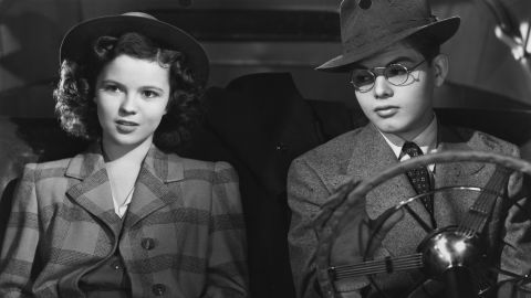 Temple and Dickie Moore act in a scene from the film "Miss Annie Rooney" in 1942.