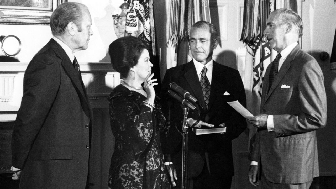 Temple Black is sworn in as new chief of protocol beside President Gerald R. Ford in the Cabinet Room of the White House in 1976.