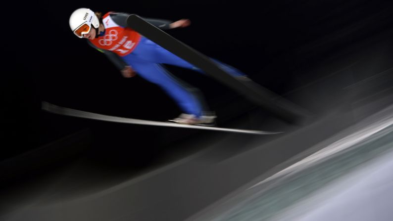 France's Julia Clair practices February 11 for the women's normal hill ski jumping event.
