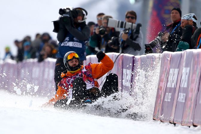 Snowboarder Dolf van der Wal of the Netherlands falls as he competes in the halfpipe on February 11.