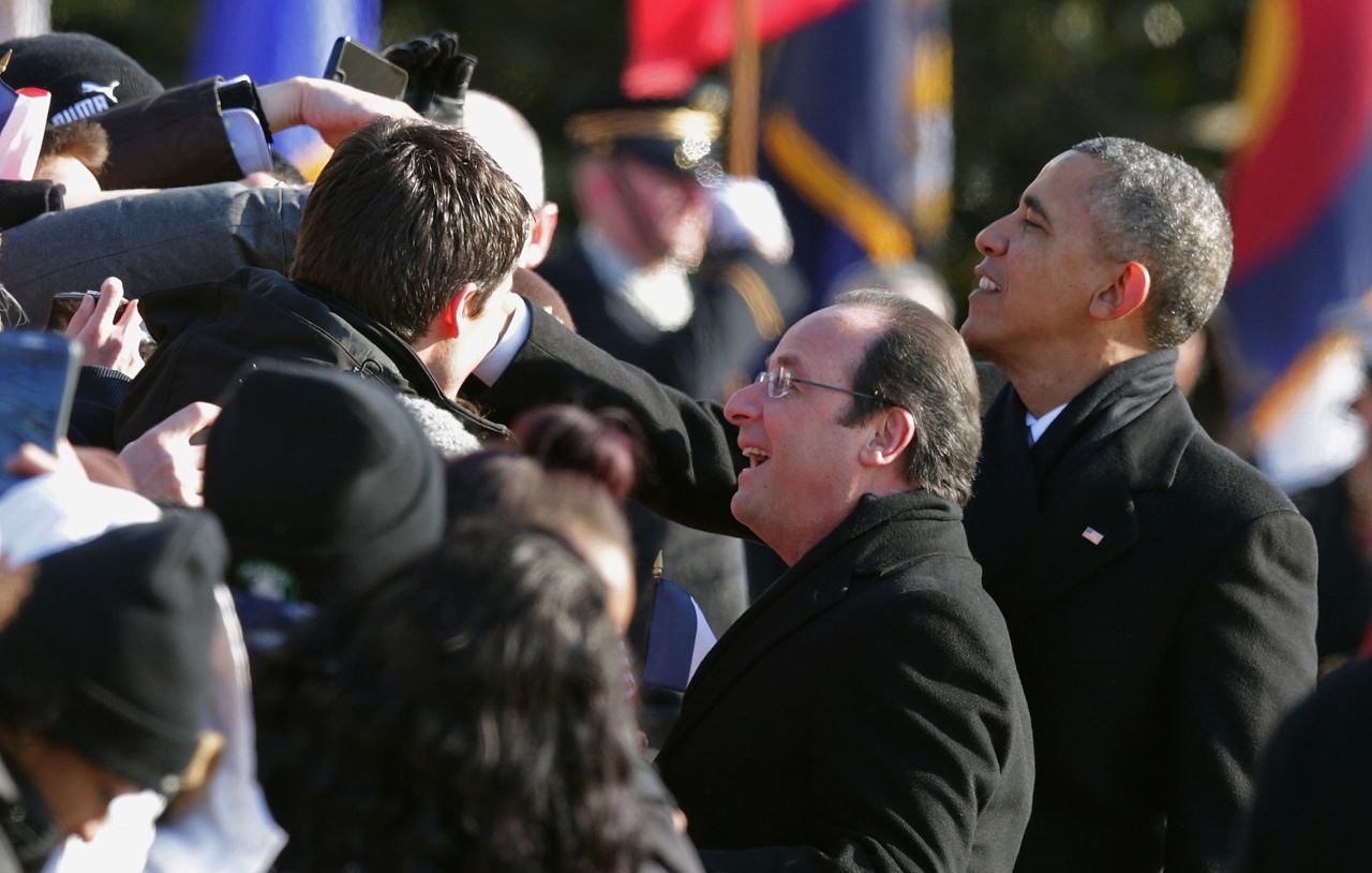 Obama and Hollande greet guests during welcoming ceremonies on February 11.