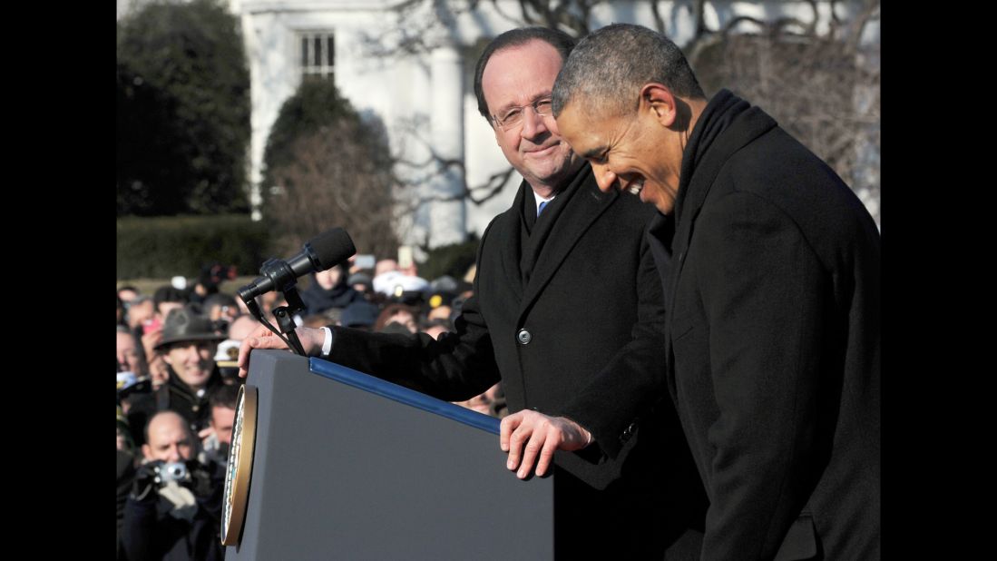 Hollande pauses as Obama laughs during the official welcome ceremony on the South Lawn.