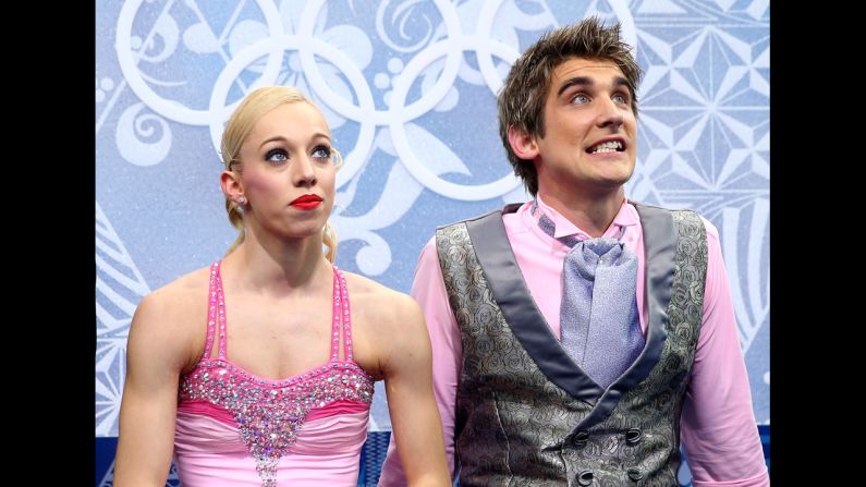 Stacey Kemp and David King of Great Britain receive their scores in pairs figure skating on February 11.