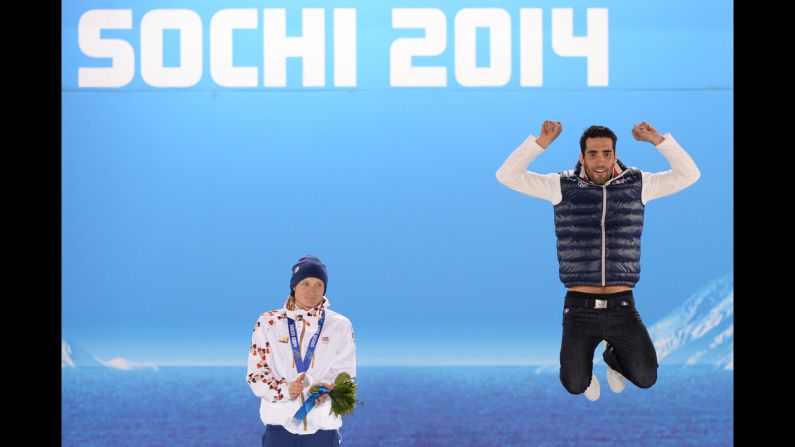 A picture taken with a robotic camera shows French biathlete Martin Fourcade, right, celebrating his gold medal in the 12.5-kilometer pursuit. To his right is silver medalist Ondrej Moravec of the Czech Republic.