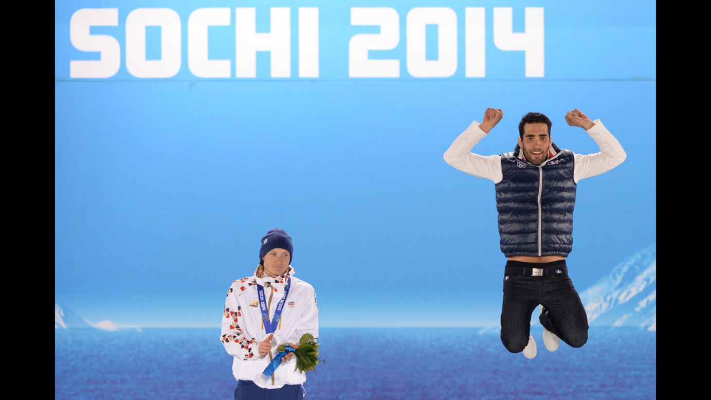 A picture taken with a robotic camera shows French biathlete Martin Fourcade, right, celebrating his gold medal in the 12.5-kilometer pursuit. To his right is silver medalist Ondrej Moravec of the Czech Republic.
