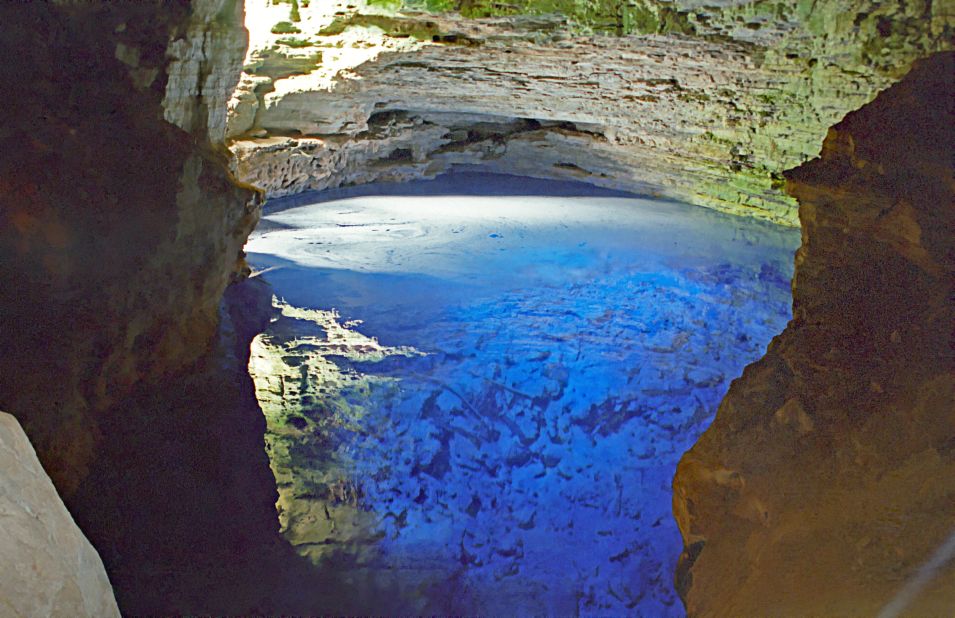 The Poço Encantado (Enchanted Well) in Brazil is an underground lake with a window to the Bahian jungle above.