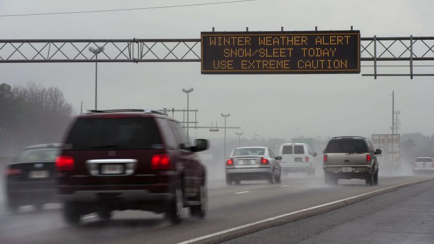 ATLANTA, GA - FEBRUARY 11:  A travel advisory sign along I-85 South warns drivers of hazardous driving conditions as a winter storm approaches on February 11, 2014 in Atlanta, Georgia. A winter storm warning has been issued for the area through Thursday, and storms Tuesday night could result in ice accumulation of up to half an inch. Widespread power outages are expected around Atlanta. (Photo by Davis Turner/Getty Images)